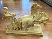 Full side view of the A. Santini chariot horse sculpture showing two horses pulling a chariot with a helmeted charioteer.