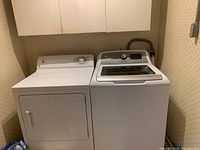 Dryer installed next to a washing machine