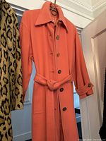 Side angle view showing sleeve button tab and pocket detail