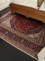 Full view of red field under bed showing overall size, design and placement