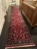 Full-length view of runner rug laid in hallway