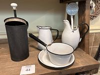 Full lot of six enamel ware items displayed on wood shelf