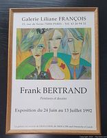 Full view of framed print showing artwork of three stylized portraits and exhibition details from Galerie Liliane François, Paris, 1992.