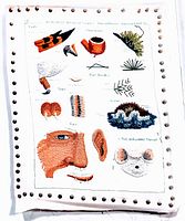 Image of the needlepoint artwork showing detailed stitching of a tobacco pipe, pine needles, face parts including ear and mouth, and a mouse face on a white fabric canvas with grommet border.