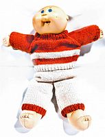 Front view of the vintage Cabbage Patch Kids doll showing face, outfit, and body condition.