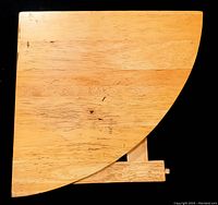 Top view of the vintage solid pine corner table showing the quarter-circle shape and natural wood grain.