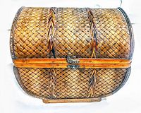 Top view of the vintage wicker basket showing woven pattern and brass closure.