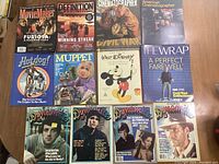 All magazines and book laid out displayed in good condition on table.