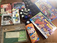 Overall lot of classic games and gaming accessories displayed