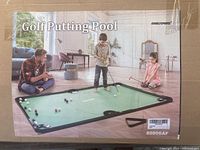 Box packaging showing Golf Putting Pool branding and game in use by children indoors