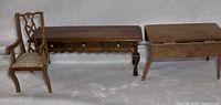 Front view of 3 dollhouse furniture pieces: Chippendale chair, hallway entrance table, and drop leaf table missing legs.