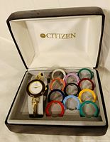 The complete Citizen ladies watch set in its original presentation box including the watch and 12 colorful interchangeable bezels.