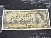 Front side of the 1954 Canadian $20 banknote showing Queen Elizabeth II portrait, serial number, and denomination details.