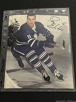 Full view of the 8x10 photo showing Ron Ellis on the ice in Toronto Maple Leafs uniform with autograph visible.
