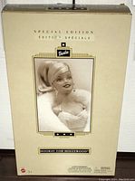 Front of unopened Special Edition Barbie box showing portrait of Barbie in white fur and gold lettering.