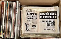 Box filled with vintage magazines and a visible 1964-65 Annual Musical Express magazine on top.