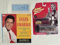 Photo showing the front side of the set: signed ticket, original Elvis Charro picture sleeve, and Johnny Lightning collectible car in packaging.