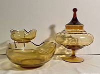 Photo showing the amber glass lidded candy dish and the chip and dip set against a neutral background.