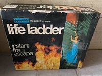 Box packaging for American LaFrance life ladder showing branding and safety usage.