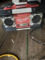 Front view of Milwaukee jobsite stereo showing speakers, control panel, and Milwaukee branding