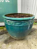 Full side view of turquoise glazed jardiniere showing shape and surface condition