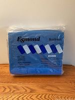 Blue Esmond brand vintage blanket in original sealed packaging with brand and material info visible.