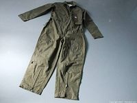 Full view of the olive green pilot suit laid flat showing sleeves, legs, and front zipper.