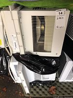 Photo showing two Electrolux window air conditioner units stacked