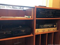Wide view of wooden shelving showing all three units