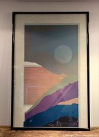 Framed serigraph artwork showing abstract design with geometric shapes and moon-like circle, photographed from the front.