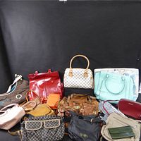 Wide image showing assortment of handbags with various colors and styles, including brown striped Dooney & Bourke and large red tote.