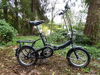 Full left side view of the bike showing frame, wheels and handlebars