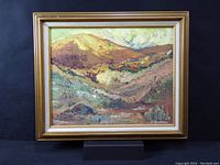 Full view of the framed original acrylic landscape painting on canvas showing the colorful textured hills and foliage.