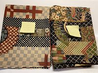 Two folded fabric pieces side by side with sticky notes showing sizes and material details.