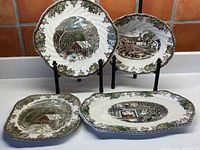Photo showing all four Johnson Bros. serving pieces with scenic rural and Christmas designs.