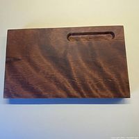 Top shot showing the full rectangular solid maple cheeseboard with a groove for knife placement.