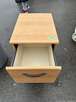 Top down view showing open top drawer interior and surface finish.