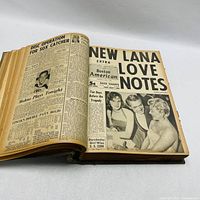 Open view of a yellowed newspaper page from the bound volume showing a front page titled 'NEW LANA LOVE NOTES' and various smaller articles and images.