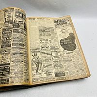 Photo of a page inside the bound volume showing vintage advertisements and articles from a 1943 newspaper.