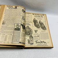 Image of open book showing vintage newspaper pages with articles and ads from September 1949.