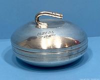 Photo of the silver plated curling stone dish lid with engraved date 1952 and handle.