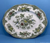 Full view of the oval Wedgwood Kent pattern platter showing the scalloped edge and overall floral and bird design