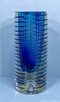 Front view of blue Sommerso glass vase showing tubular inside design and horizontal stripes.