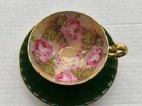 Top-down view of teacup seated on matching saucer against white background