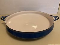 Large blue Dansk paella pan, white enameled interior, deep blue exterior, two handles