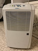 Front view of white Danby Designer dehumidifier showing front grill and control panel area