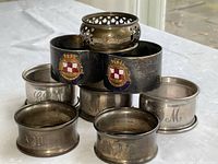 Eight sterling silver napkin rings stacked showing overall arrangement