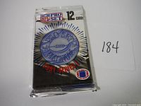 Two unopened sealed packs of 1991 NFL Pro Set Series 1 football trading cards, each pack containing 12 cards.
