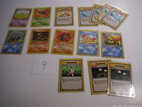 Full spread of 15 Pokémon Fossil cards showing a variety of Pokémon and Trainer cards.