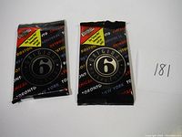 Four unopened packs of Original 6 hockey cards from the early 1990s, black wrappers with colorful team names and Original 6 logo.